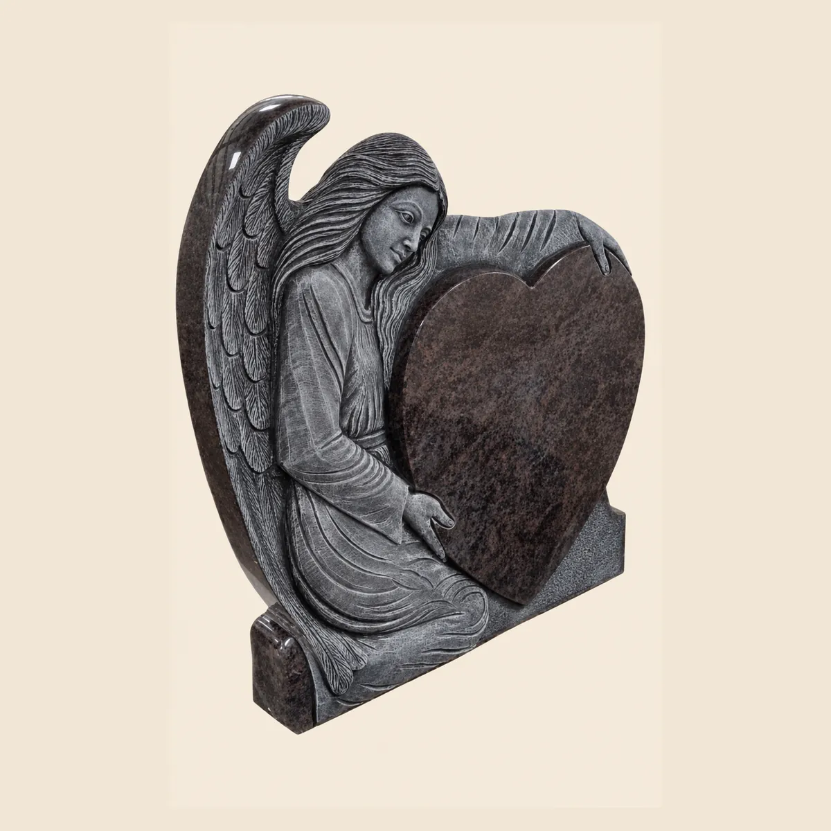 Angel with heart carved from a single block of Paradiso granite