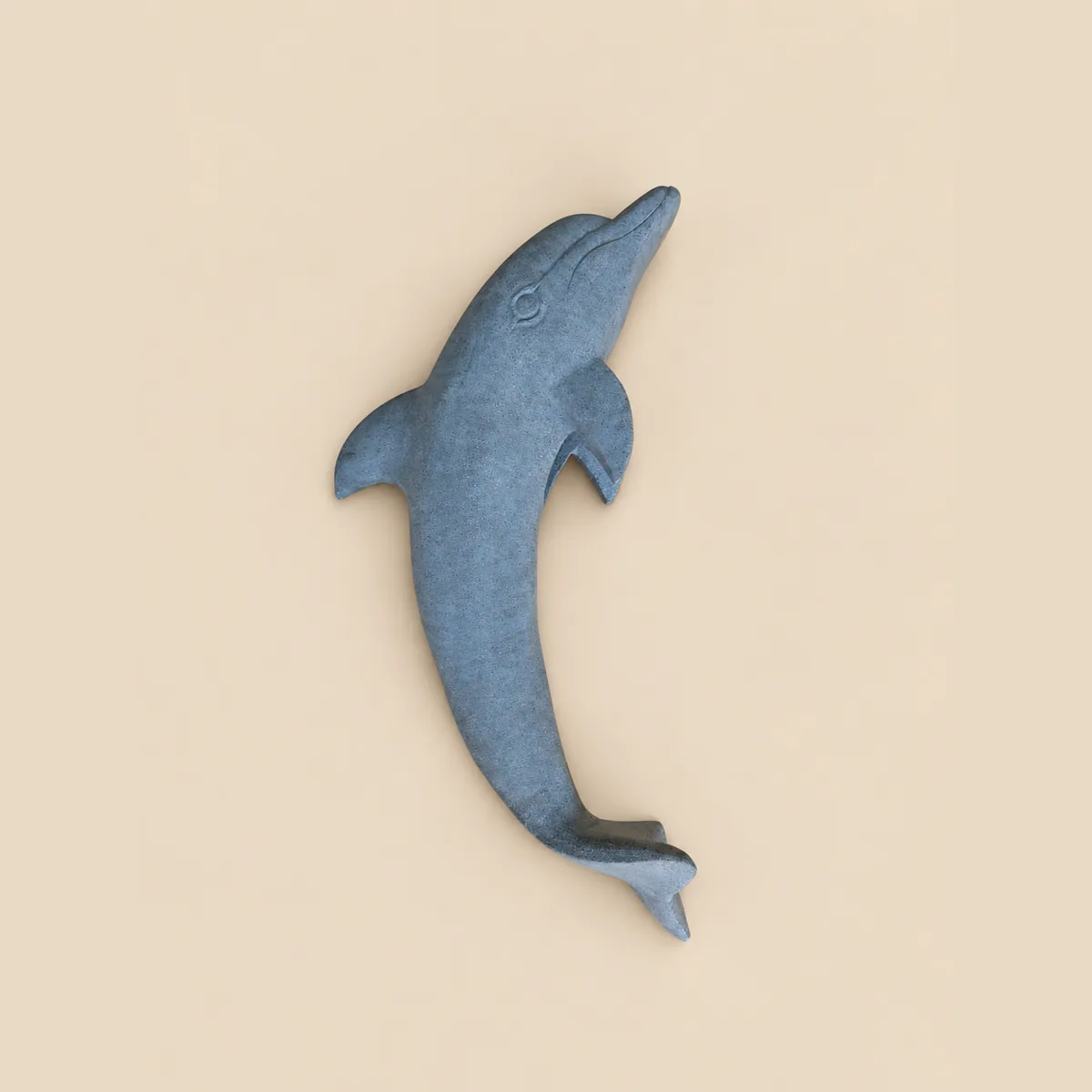 Leaping dolphin carved in blue-grey granite