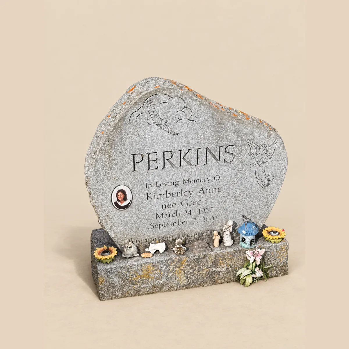 Grey rock-pitched upright with a ceramic portrait, etched roses and an angel