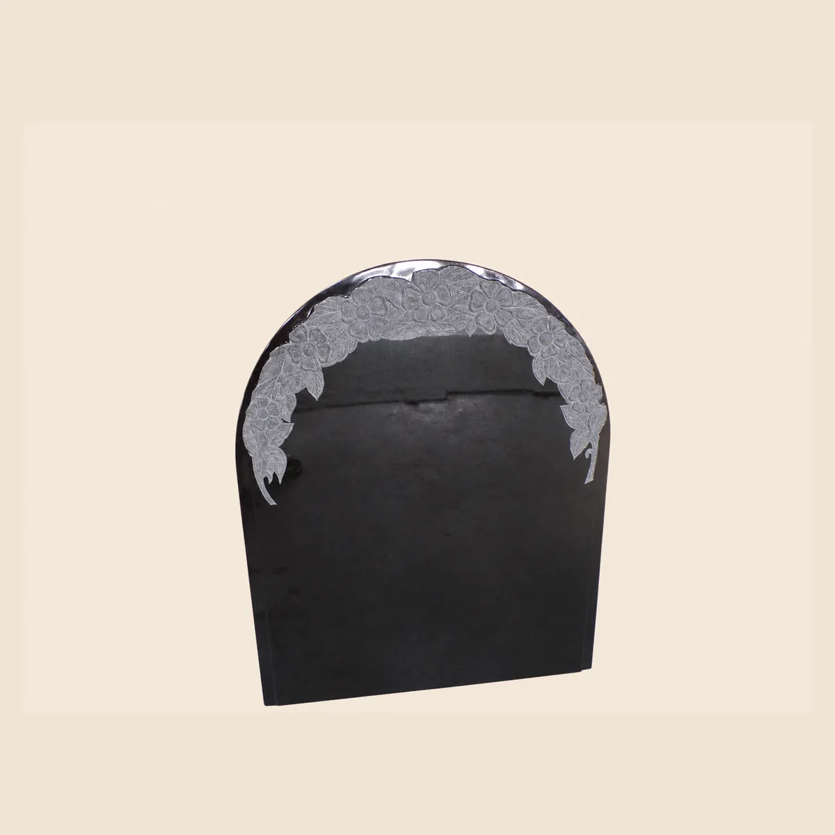 Black granite rounded-top upright with a sandblasted rose border