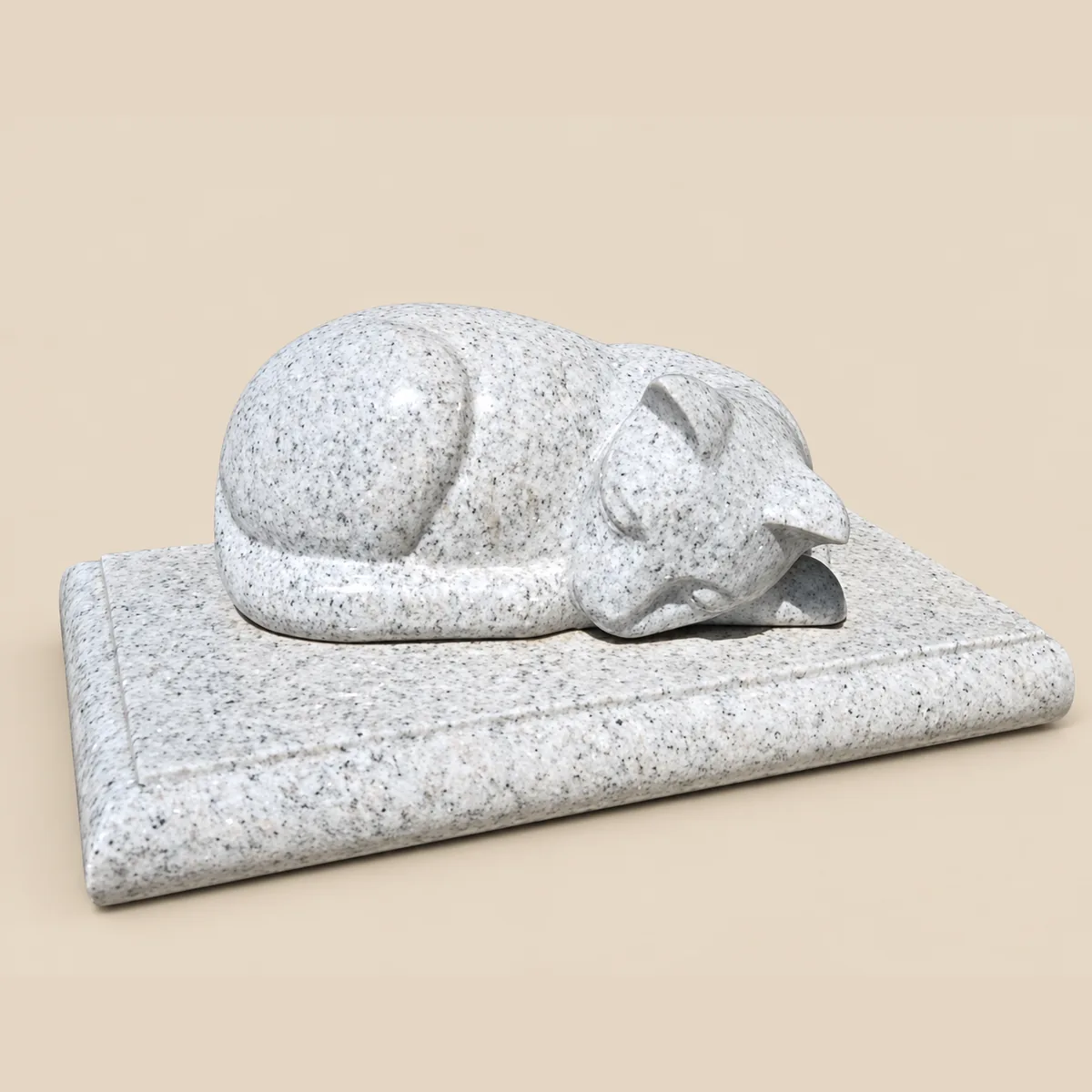 Sleeping cat carved in grey granite on a matching base