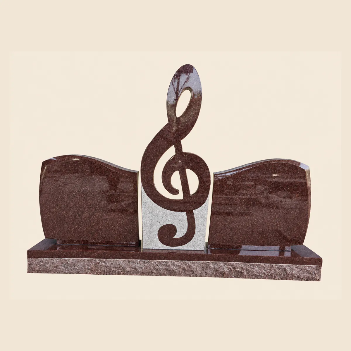 Ruby Red granite double memorial with a treble clef centrepiece