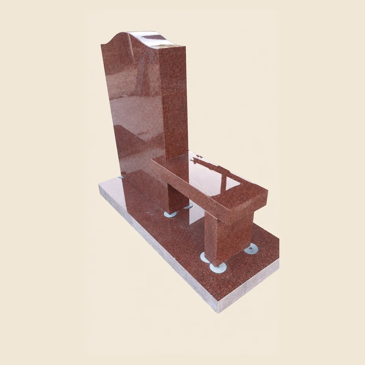 Ruby Red granite upright with an attached seat on a matching base